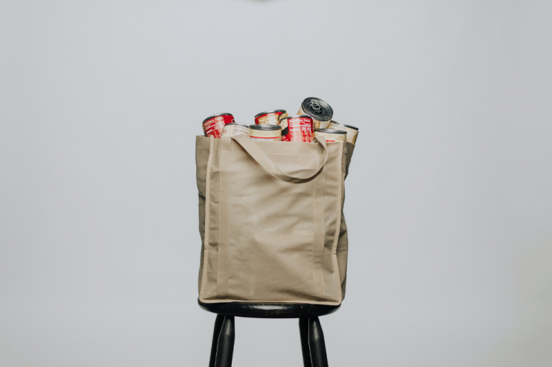 a bag of groceries on a stool